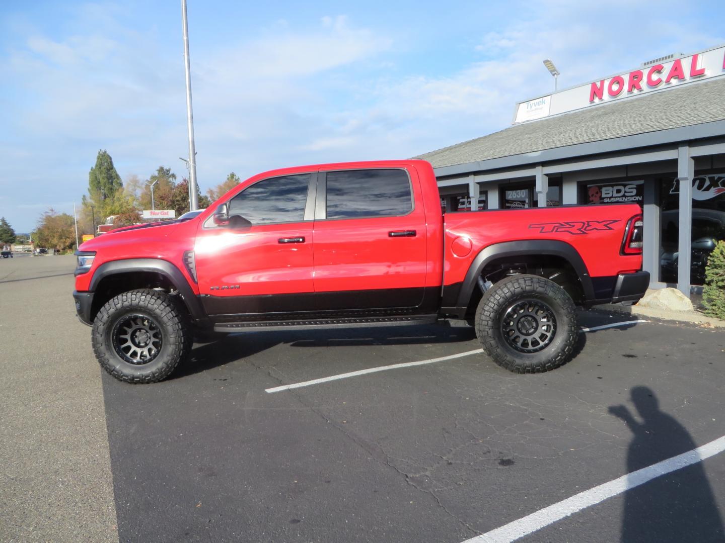 2023 Red /BLACK RAM 1500 Ram 1500 TRX Crew Cab 4x4 (1C6SRFU9XPN) with an 6.2L Supercharged HEMI V8 SRT engine, 8 Speed Auto 8HP95 transmission, located at 2630 Grass Valley Highway, Auburn, CA, 95603, (530) 508-5100, 38.937893, -121.095482 - Must see TRX featuring Eibach front and rear springs, 18" Method NV double black wheels, 37" Nitto Ridge Grappler tires, and window tint. - Photo#8